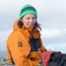 A woman posing for a photo wearing cold weather clothing