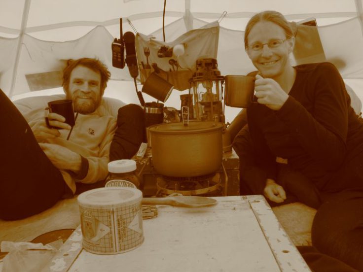 Jo and Iain enjoy a cup of tea in their tent