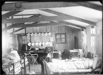 Interior of Hope Bay, Base D, Mar 1945. Thirteen occupied the hut during the austral winter, 1945. It was named Eagle House after the ship that brought in most of the building materials. (Photographer: Ivan Mackenzie Lamb; Archives ref: AD6/19/1/D168)