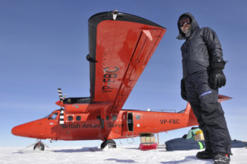 A man that is standing in the snow.