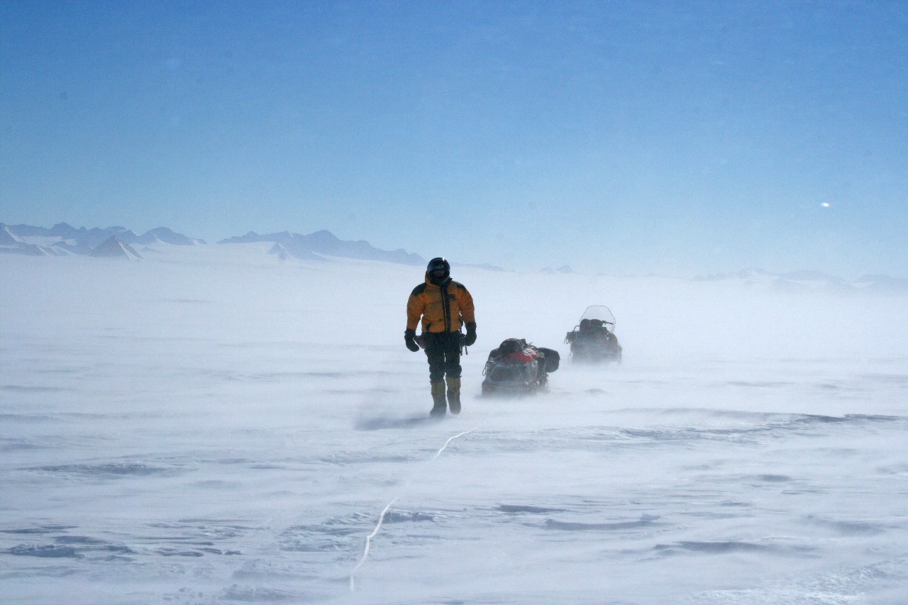 A person walking in an icy landscape