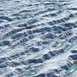 A close up of a snow covered slope.