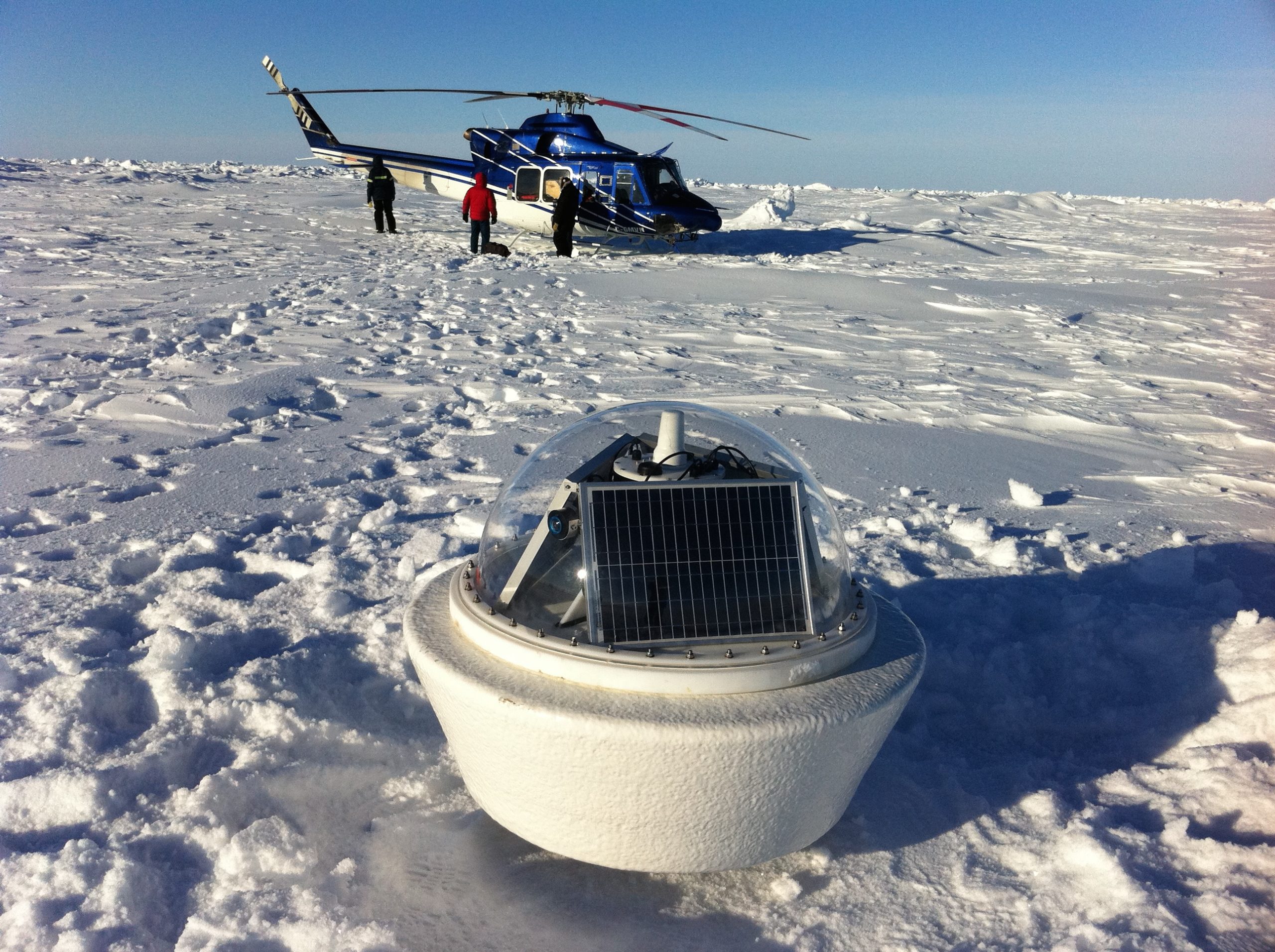 A man flying through the air while riding skis.
