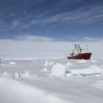A airplane that is covered in snow.