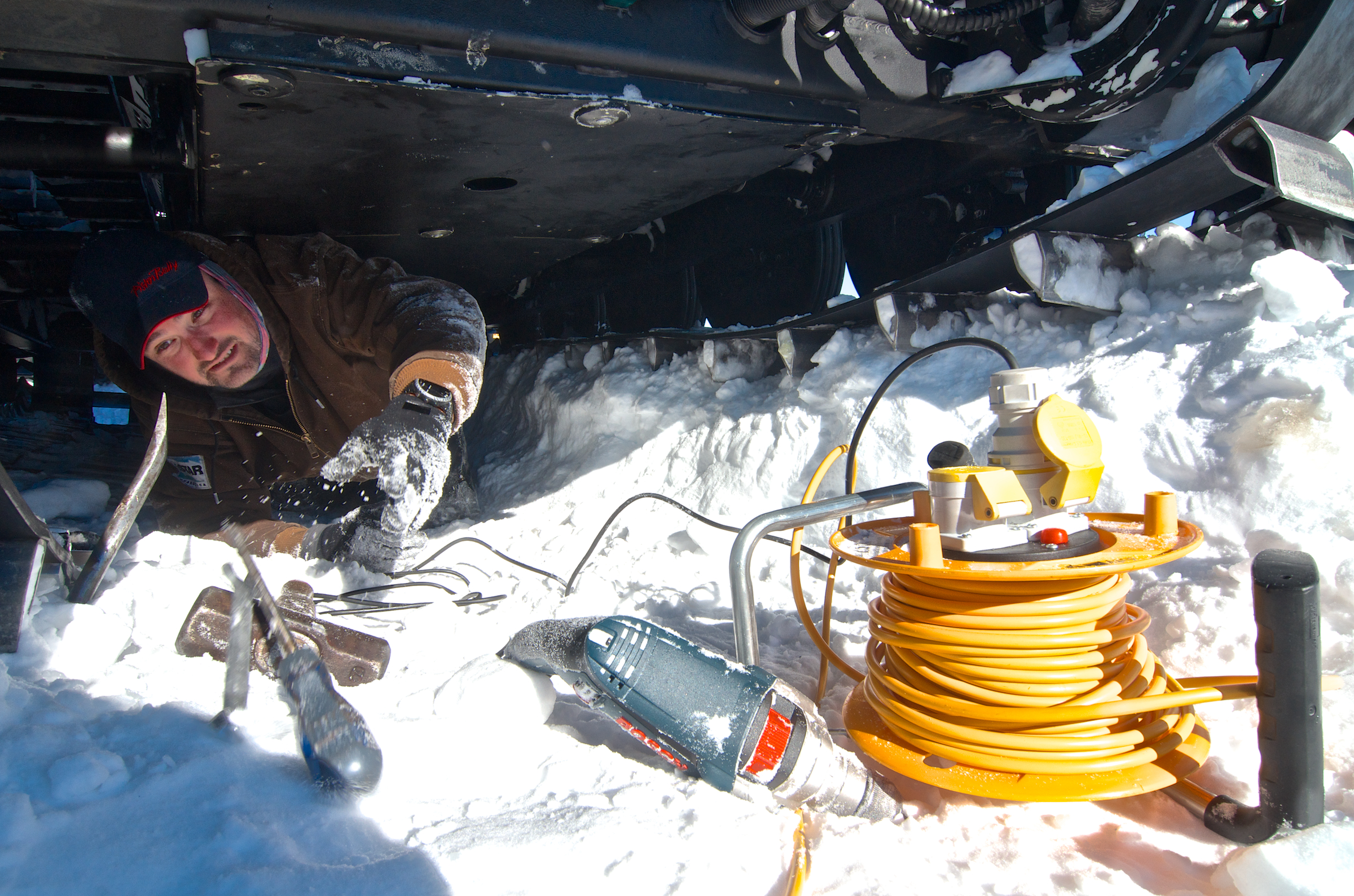 A person working under a vehicle