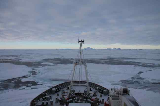 The RSS James Clark Ross in the Weddell Sea, with sea ice and icebergs