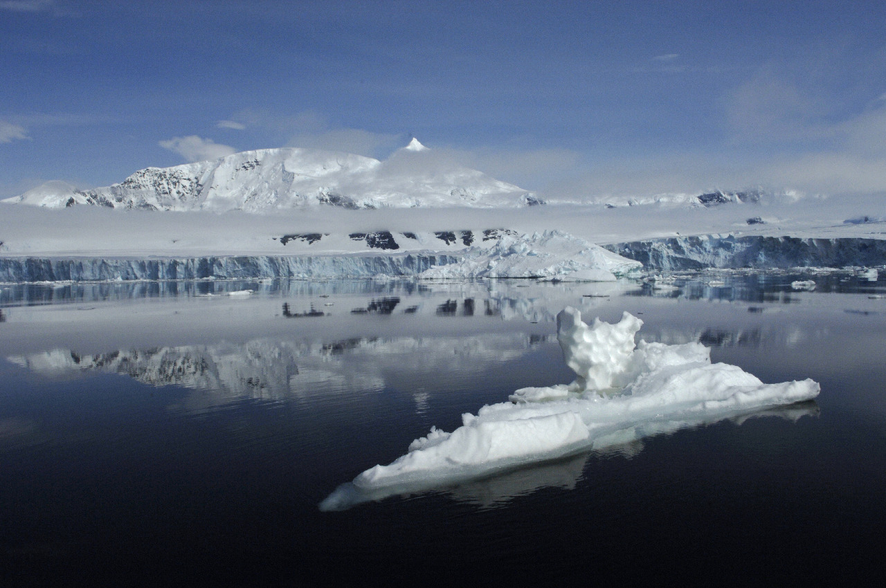 Smoke coming out of a snow covered mountain.