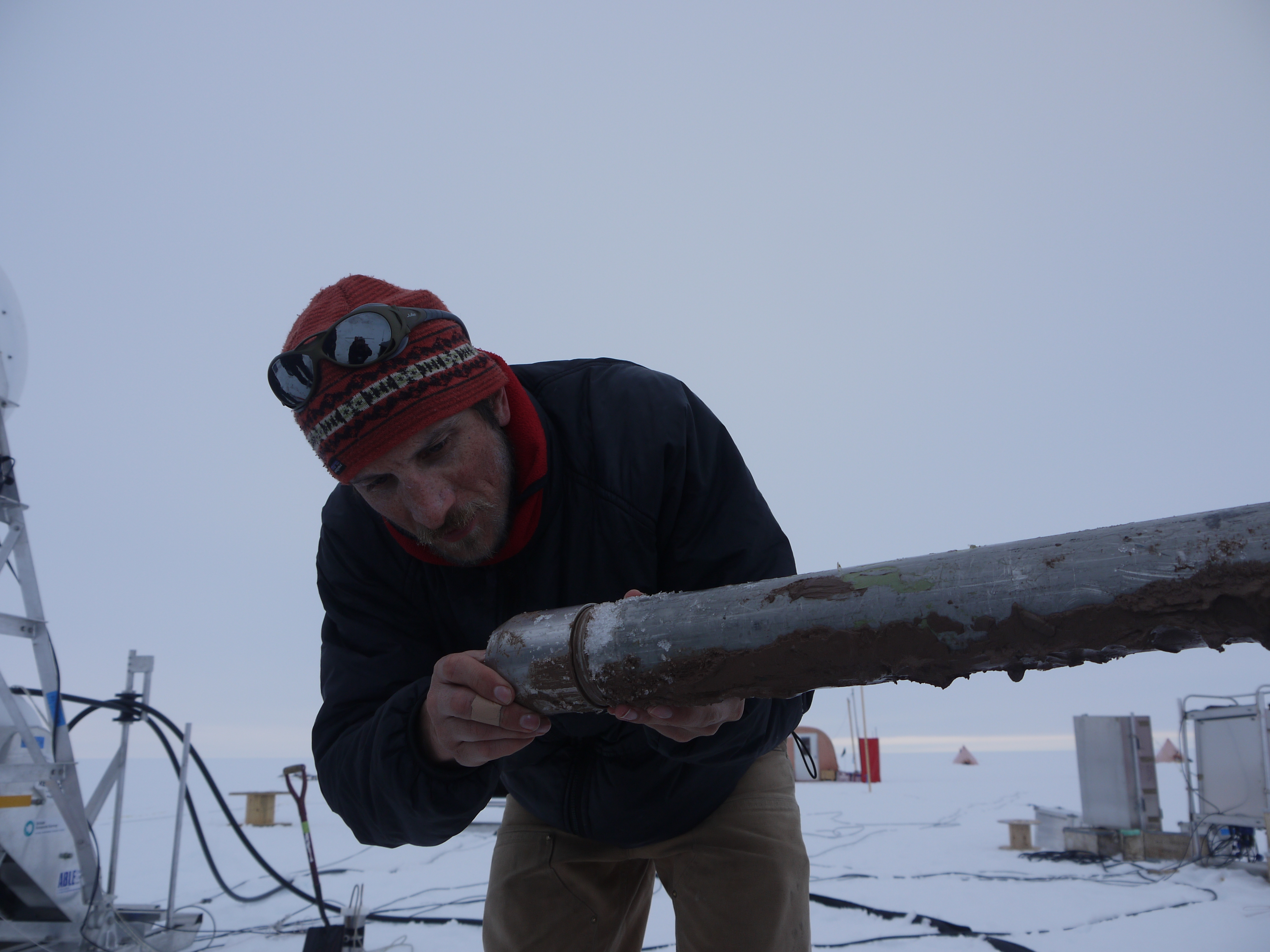 Marine geologist Dr James Smith inspects sediment core recovered from beneath 500m thick ice shelf
