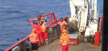 A magnetometer is deployed over the side of the RRS James Clark Ross