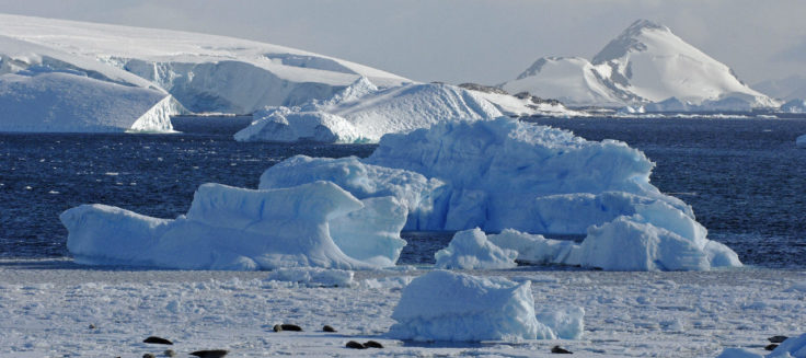 A close up of a snow covered mountain.