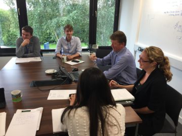 A group of people sitting at a table.