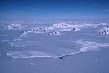 A close up of a snow covered mountain.