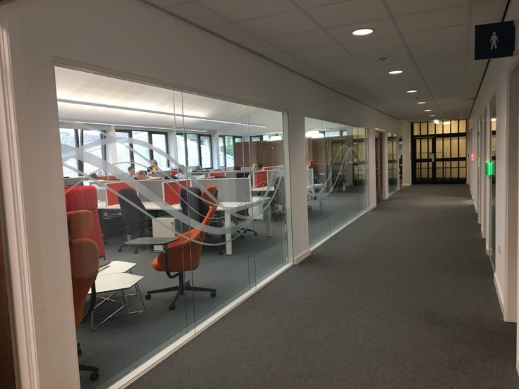 The Aurora Collaboration Space viewed through a glass wall.