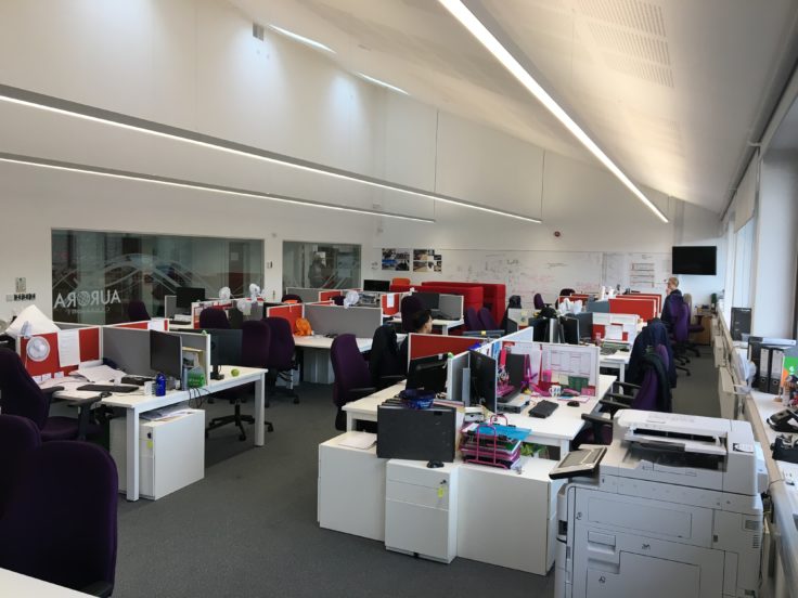 Desks with monitors in the Aurora Collaboration Space