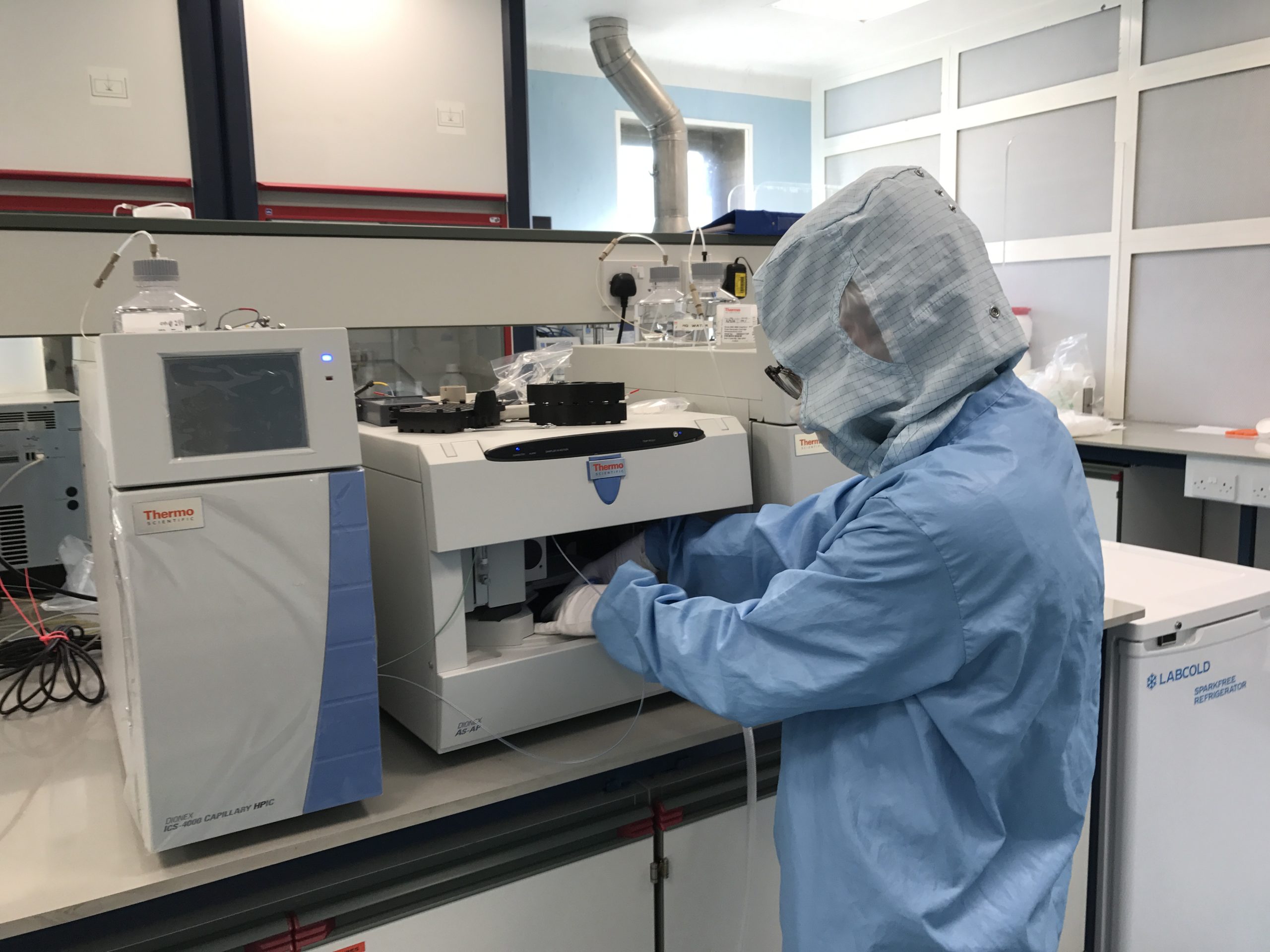 A man standing in a kitchen.