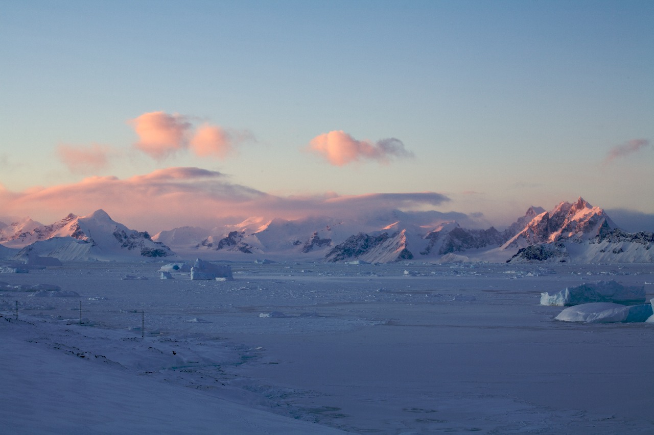 A close up of a snow covered mountain.