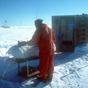 A man that is standing in the snow.