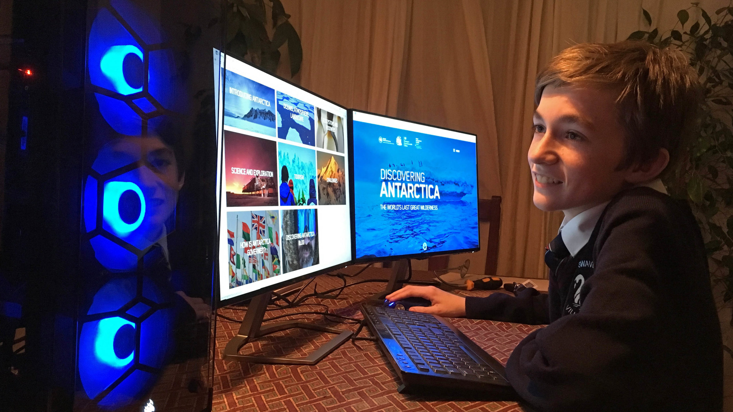 A person standing in front of a computer.