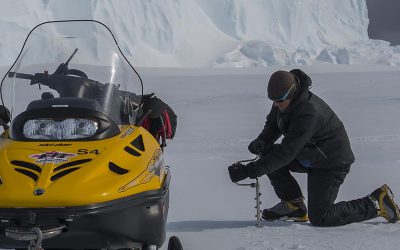 Polar Field Guide checking sea-ice thickness to ensure safe operations ahead of the ship arrival at the Brunt Ice Shelf