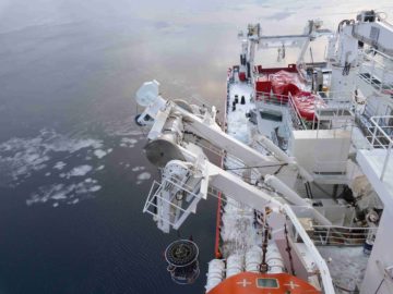 A large ship in the background.