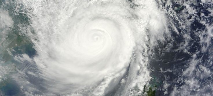 A large waterfall over a wave.