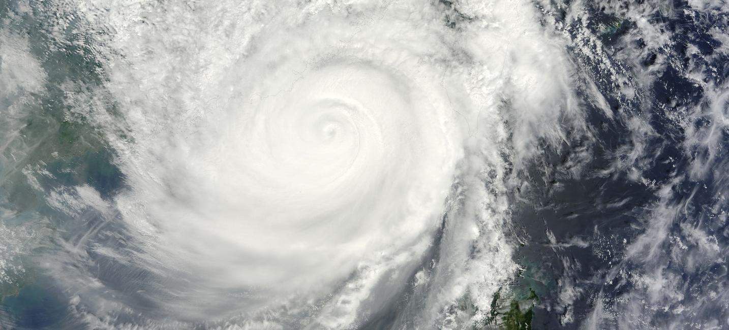 A large waterfall over a wave.