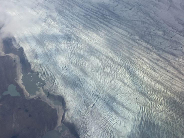 A close up of a snow covered mountain.