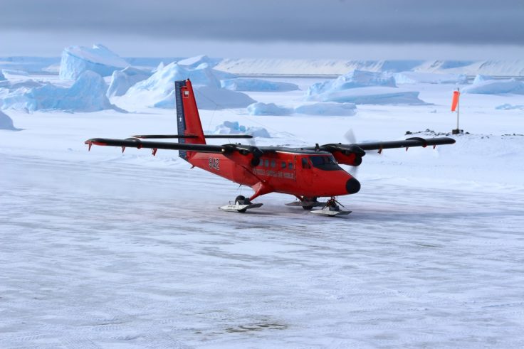 A airplane that is covered in snow.