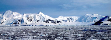 A close up of a snow covered mountain.
