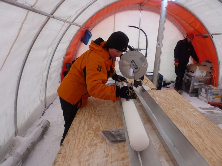 Liz Thomas measuring the ice core in the field