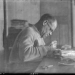 Lt. Cdr. James Marr at work mending webbing, Bransfield House, Port Lockroy, 18th June 1944. (Photographer: E. Mackenzie (I.M. Lamb). Archives ref: AD6/19/1/A7