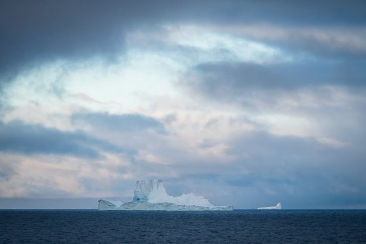 An iceberg in large body of water.