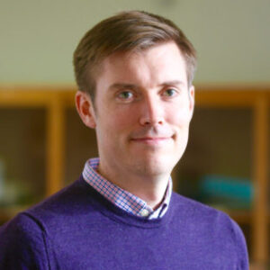 A man in a blue shirt.