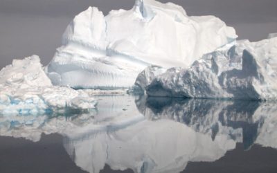 A close up of a snow covered mountain.