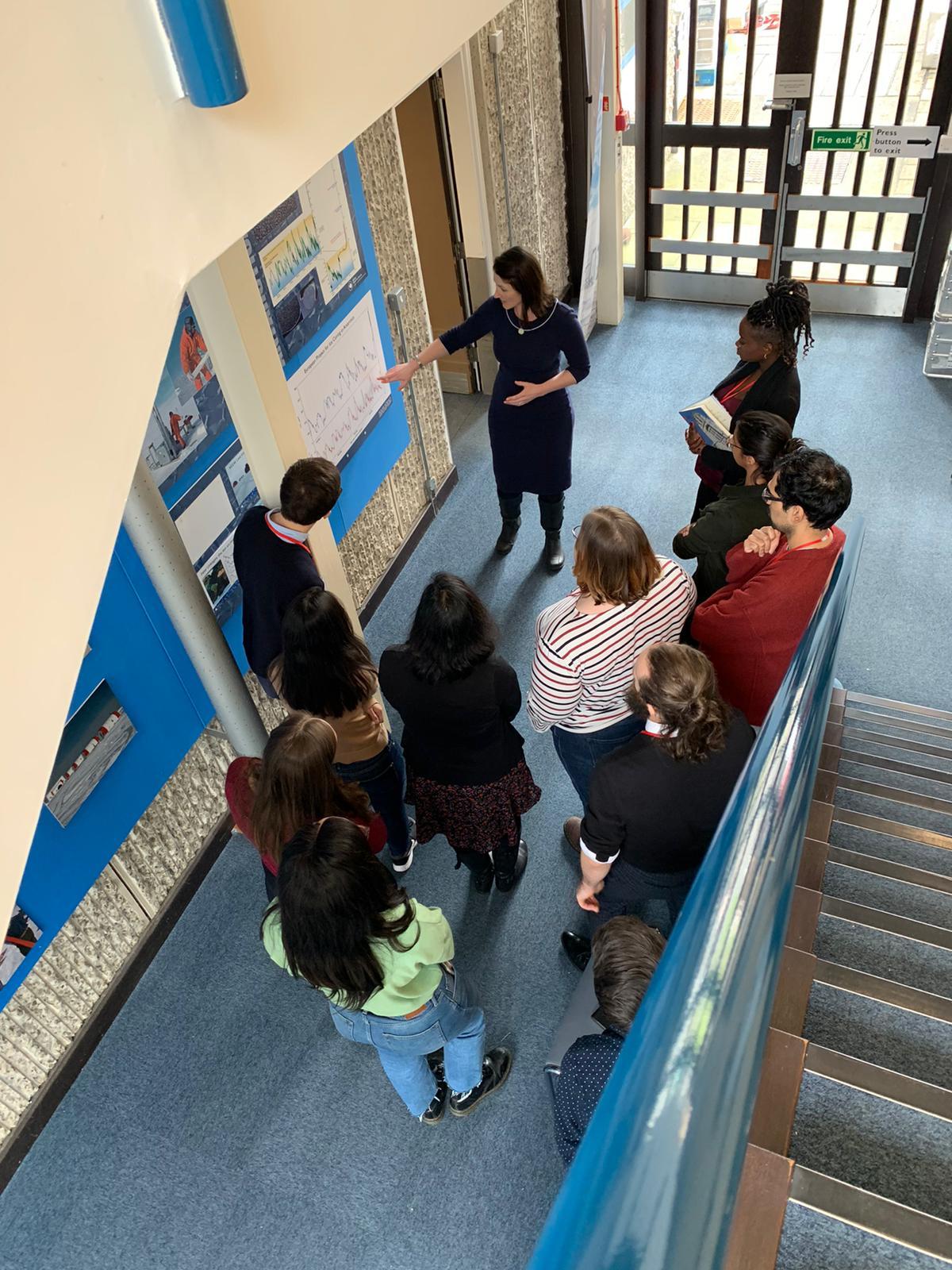 A group of people sitting on a bench.