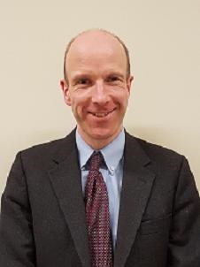 A man wearing a suit and tie.