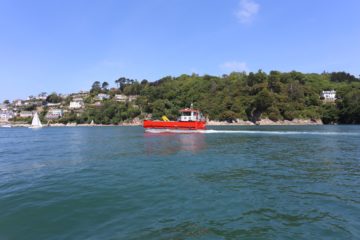 A small boat in a large body of water.