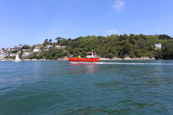 A small boat in a large body of water.
