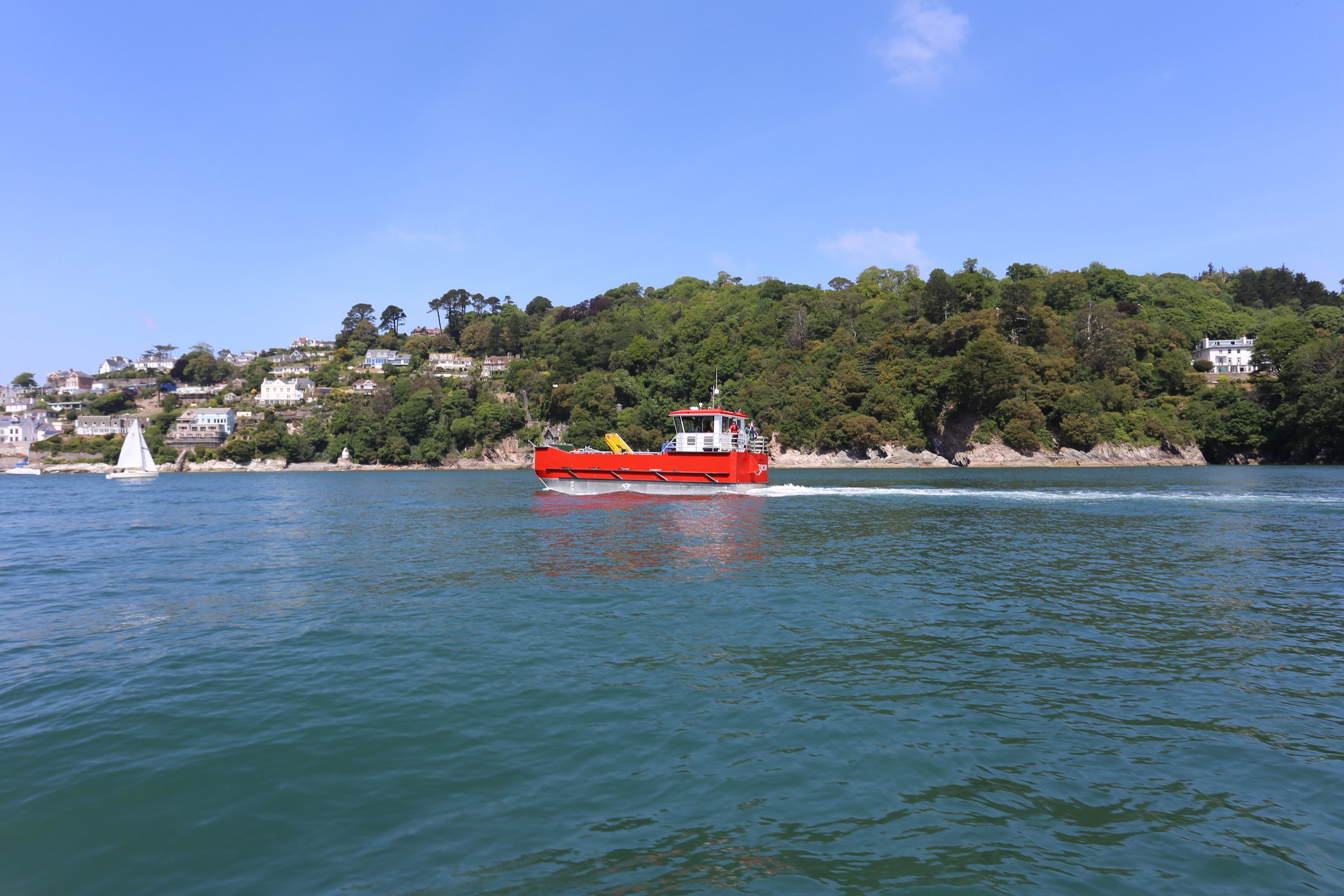 A small boat in a large body of water.
