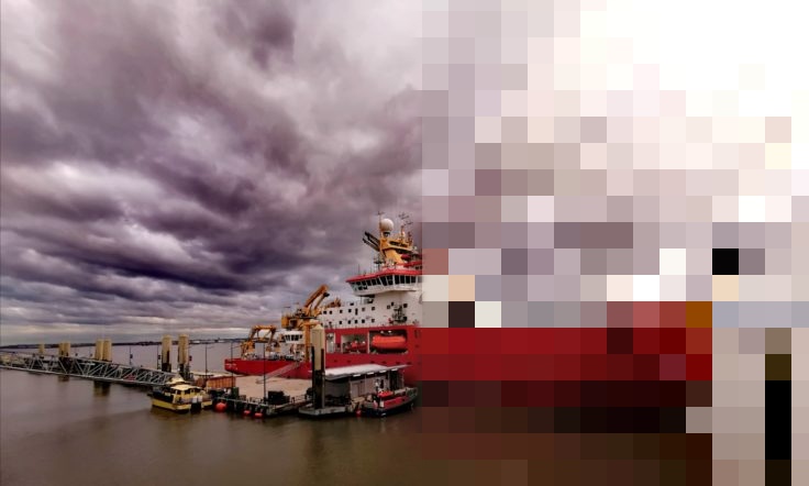 SDA ship in harbour with dramatic lansdcape, pixelated image