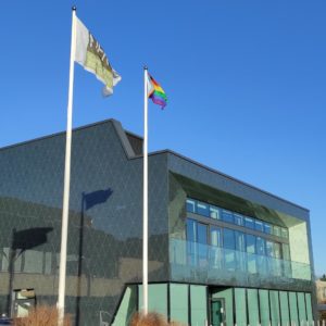 A sign in front of a building