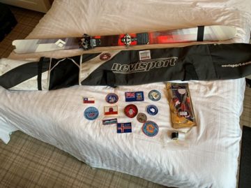 A cat sitting on top of a bed