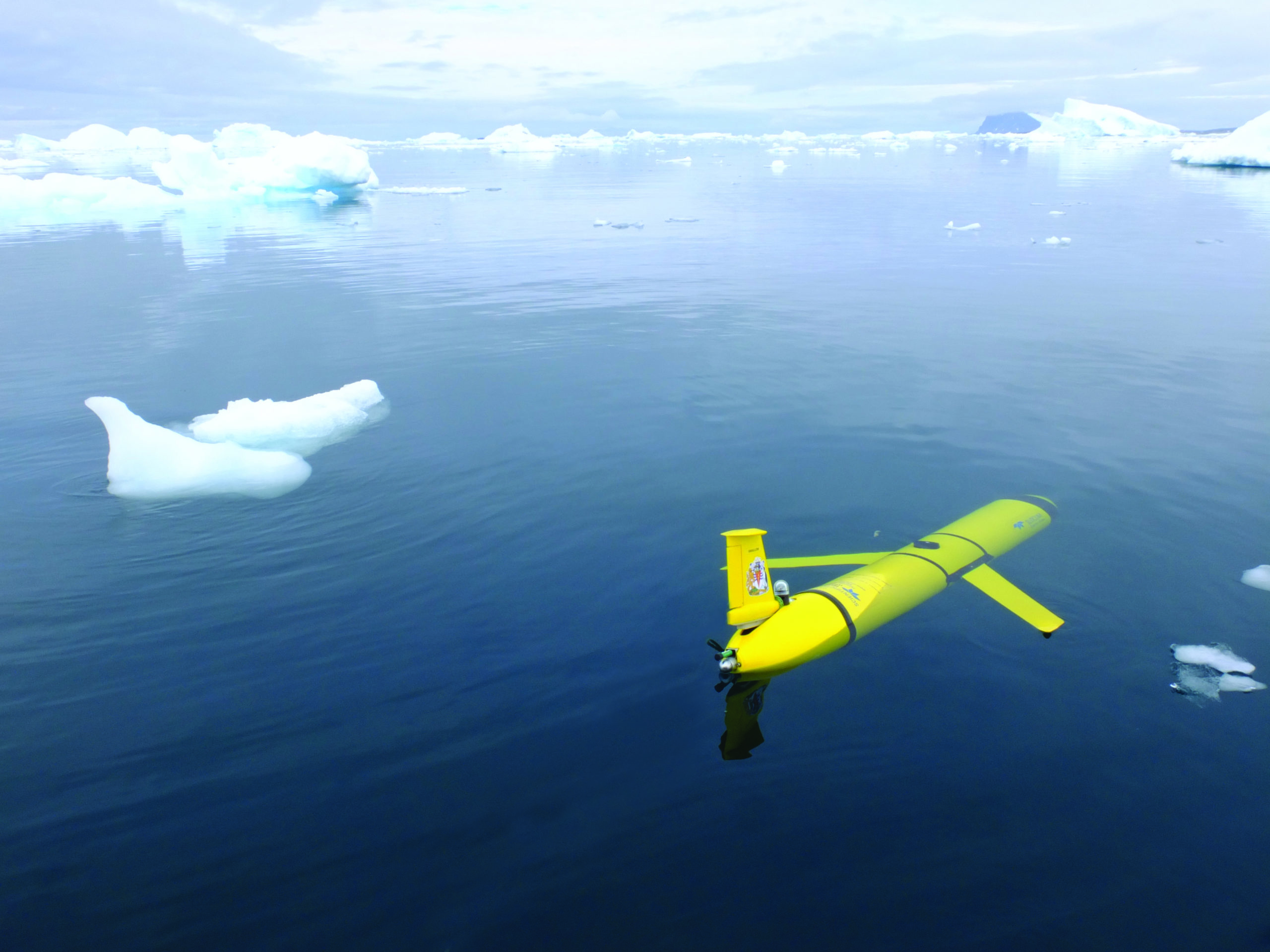 Ocean glider at sea surface surrounded by ice