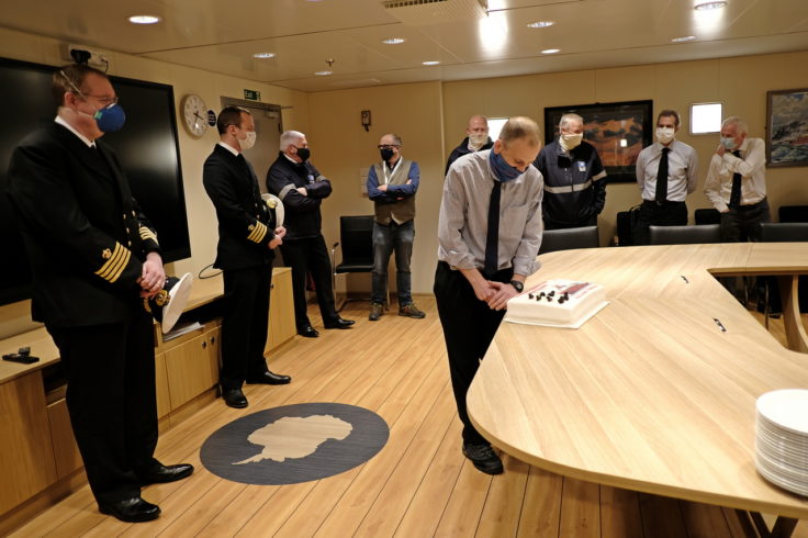 A group of people standing in a room