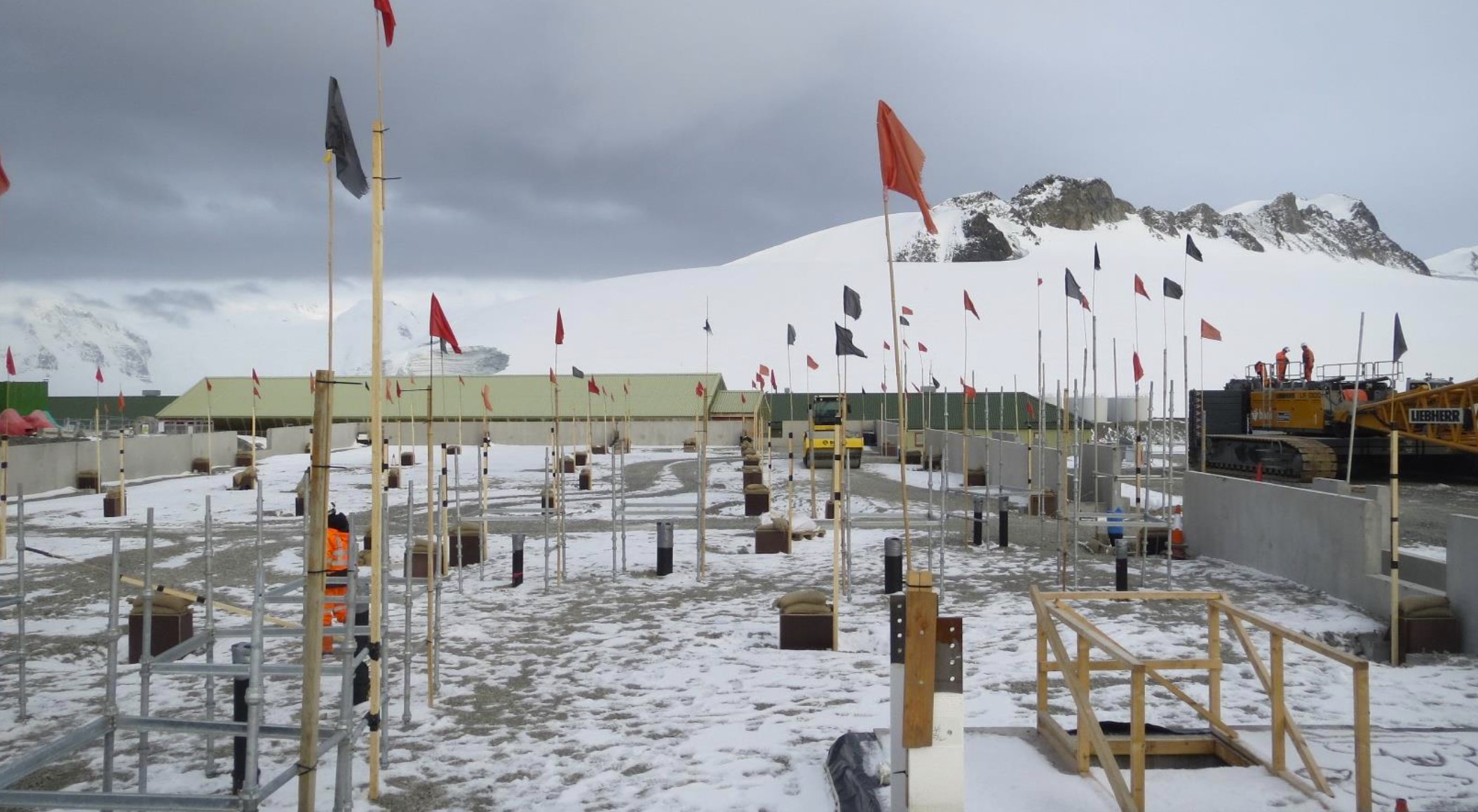 The Discovery Building site marked with flags and scaffolding