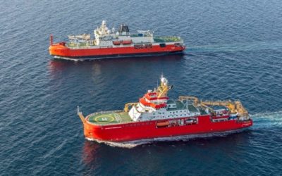 Two large red research ships in the ocean