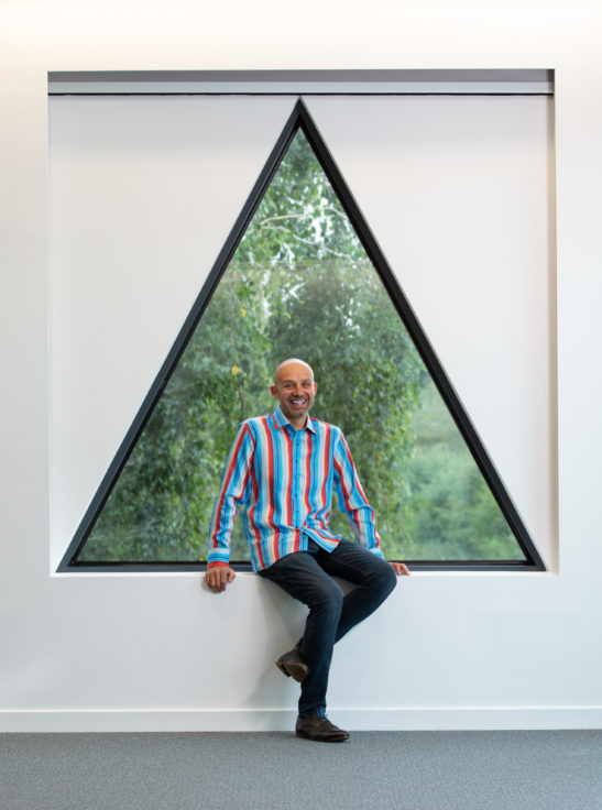 A man standing in front of a window