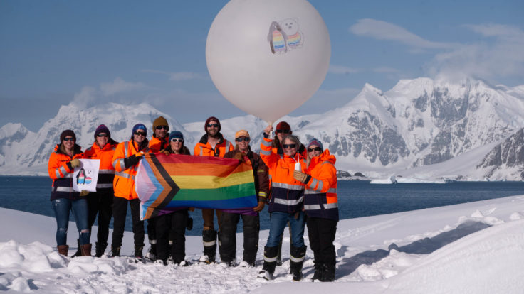 A group of people that are standing in the snow