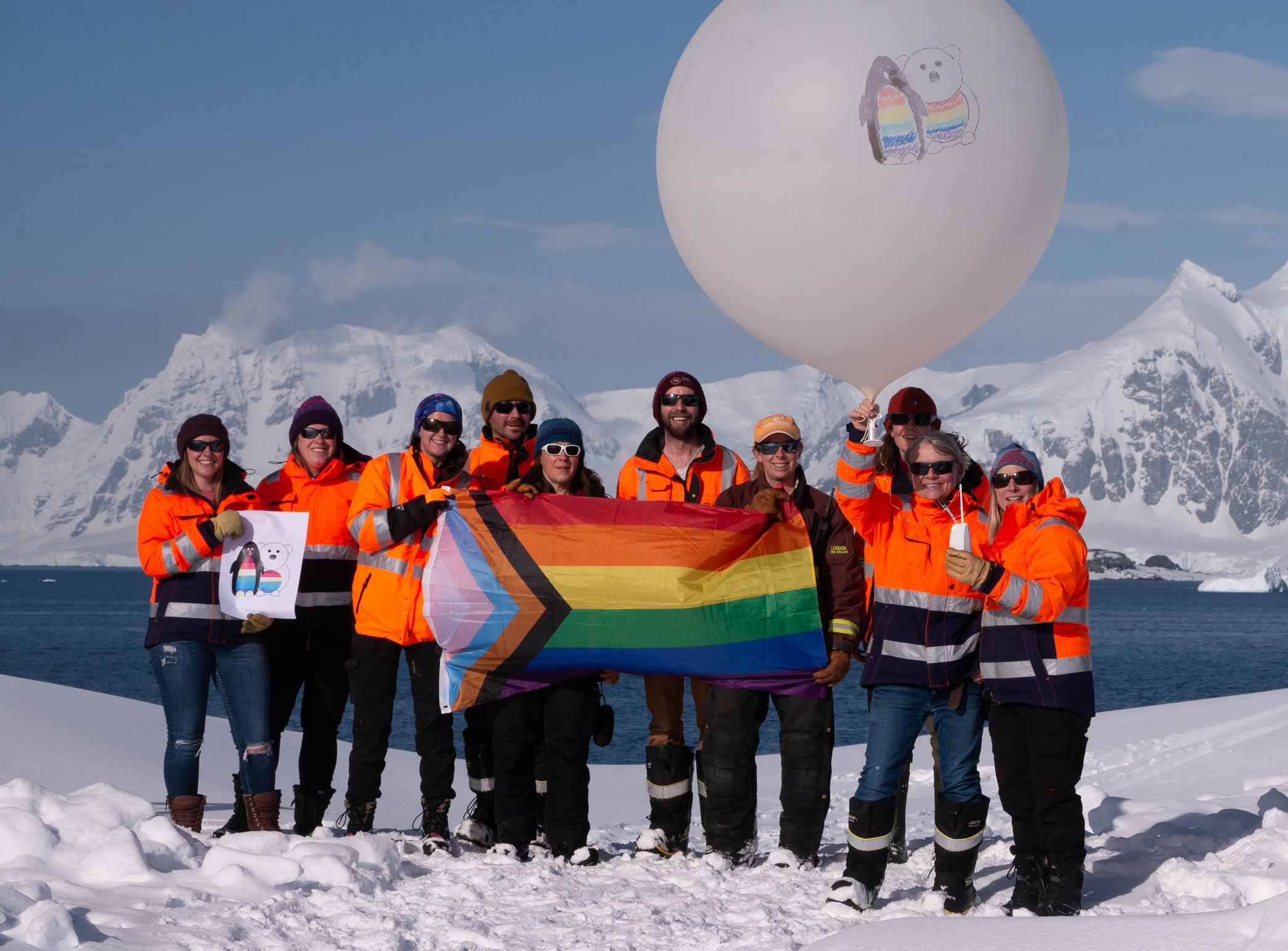 A group of people standing in the snow