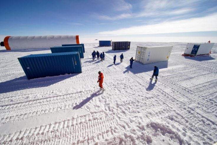 A group of people walking in the snow